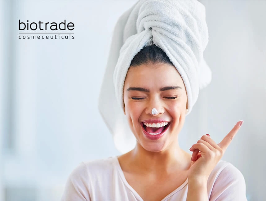 Biotrade — жена с крем на лицето и логото на козметичния бранд